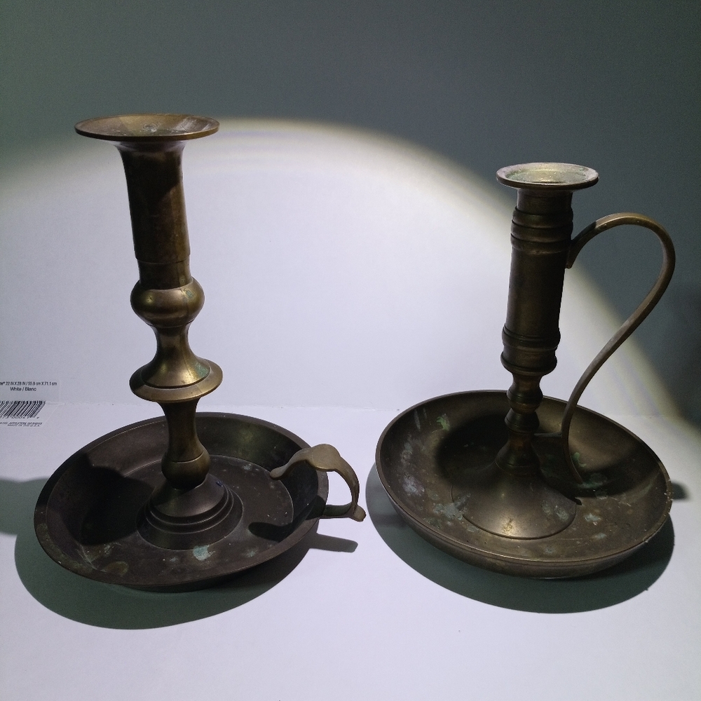 Two vintage solid brass candle holders sizes in pics